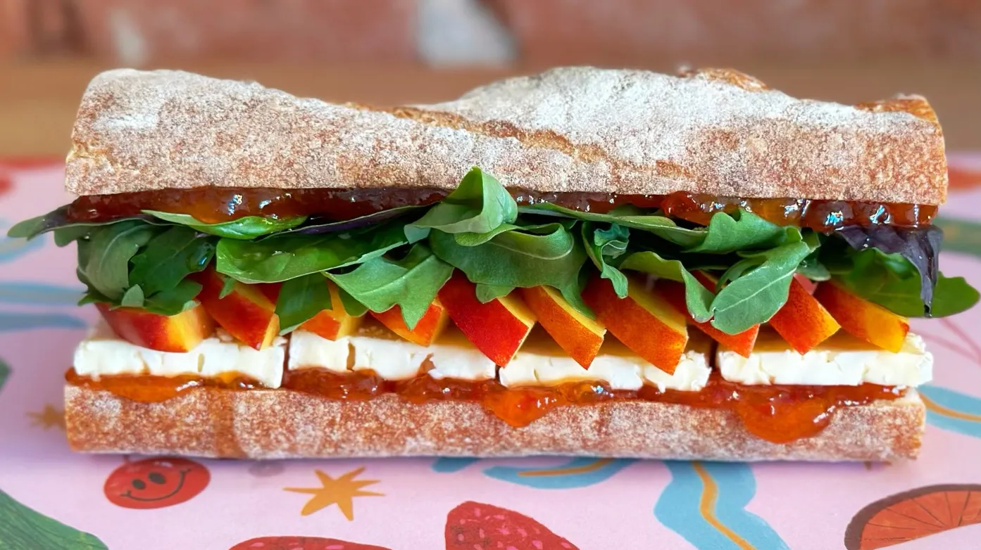 The Venice Cowgirl sandwich from Lady & Larder features summer stone fruit and a triple cream cheese.