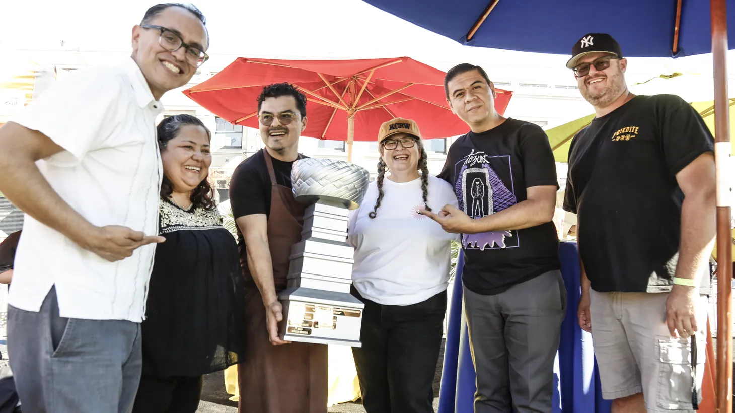 From left to right, tortillas tournament founder Gustavo Arellano, judge Connie Alvarez, winner Carlos Salgado, Good Food host Evan Kleiman, guest judge Chris Estrada, and tortilla scout Sean Vukan.