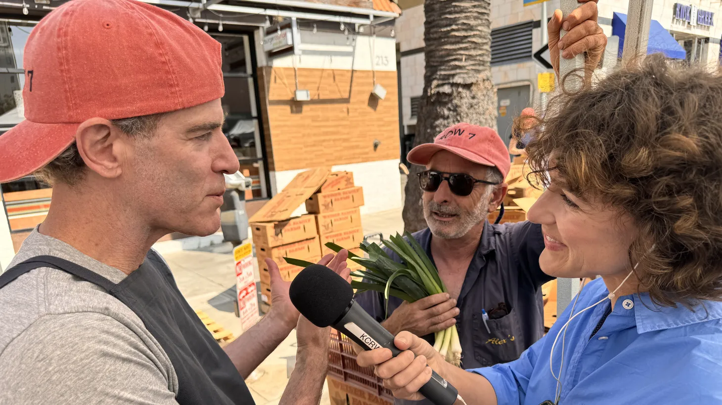 Chef Dan Barber (left) talks to Good Food's market correspondent, Gillian Ferguson, about garleek, a new allium grown by farmer Alex Weiser (middle).