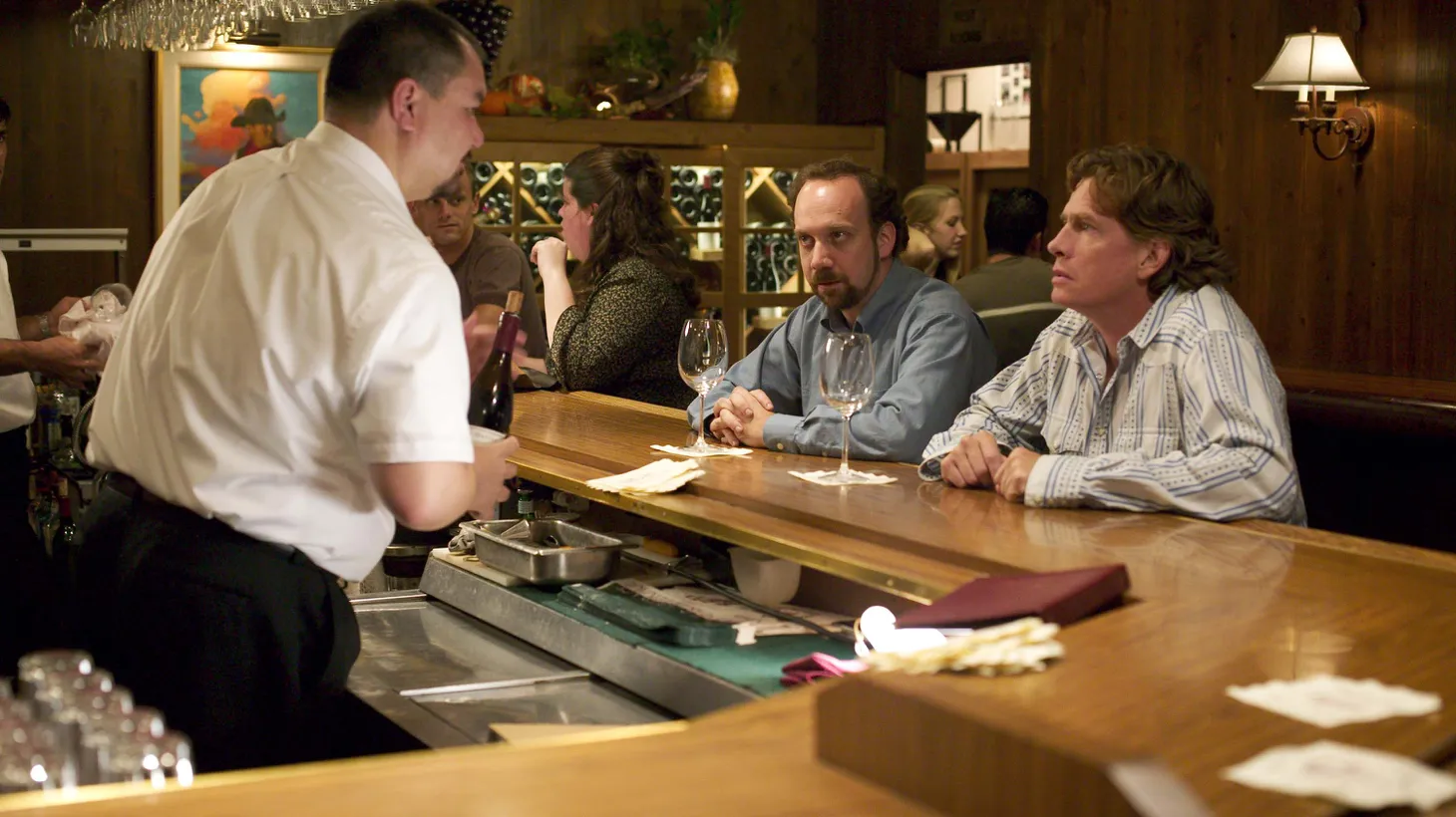 Paul Giamatti (center) and Thomas Hayden Church (right) sit at the Hitching Post bar in a scene from "Sideways."