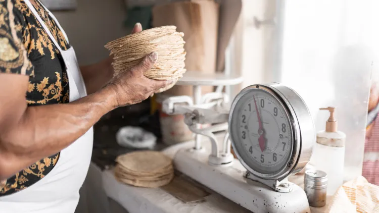 Mary Beth Sheridan details how drug cartels in Mexico have begun extorting tortilla vendors.