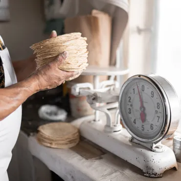 Mary Beth Sheridan details how drug cartels in Mexico have begun extorting tortilla vendors.