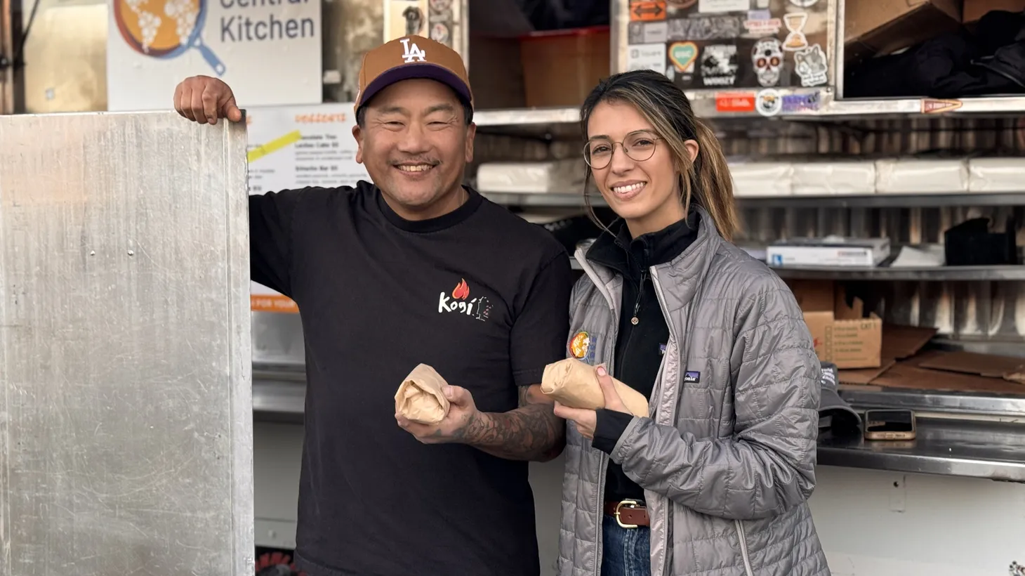 Chef Roy Choi (left) and Trish Engel of World Central Kitchen feed evacuees at Pasadena City College.