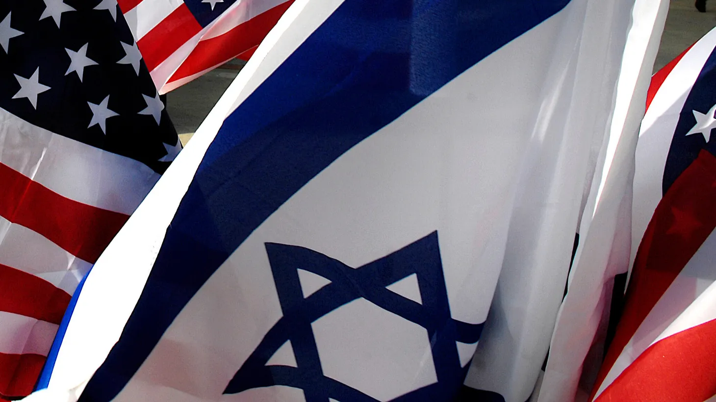 Israeli and American flags fly as U.S. Defense Secretary Robert M. Gates arrives in Tel Aviv, Israel, April 18, 2007.