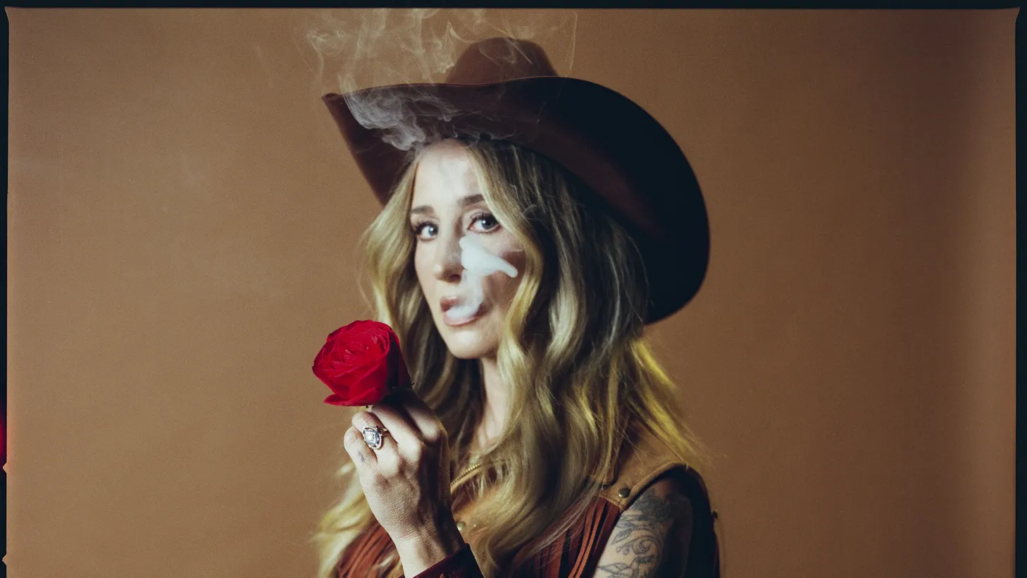 We’ve got a new one from alt-country singer Margo Price ! “Too Stoned To Cry” finds the singer sharing a mic and guitar duties with her friend Billy Strings .