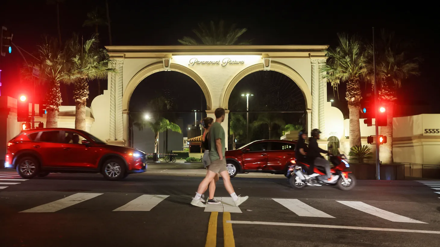 People walk outside Paramount Studios after the Writers Guild of America (WGA) said it reached a preliminary labor agreement with major studios in Los Angeles, California, U.S., September 24, 2023.