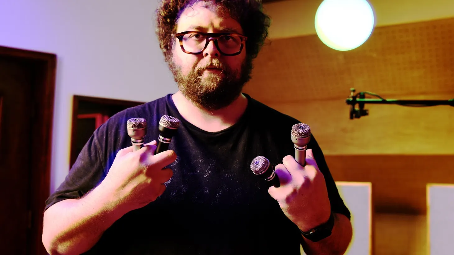 Clay Blair of Boulevard Recording poses with his vintage mics, which The Beatles used for some of their recordings.