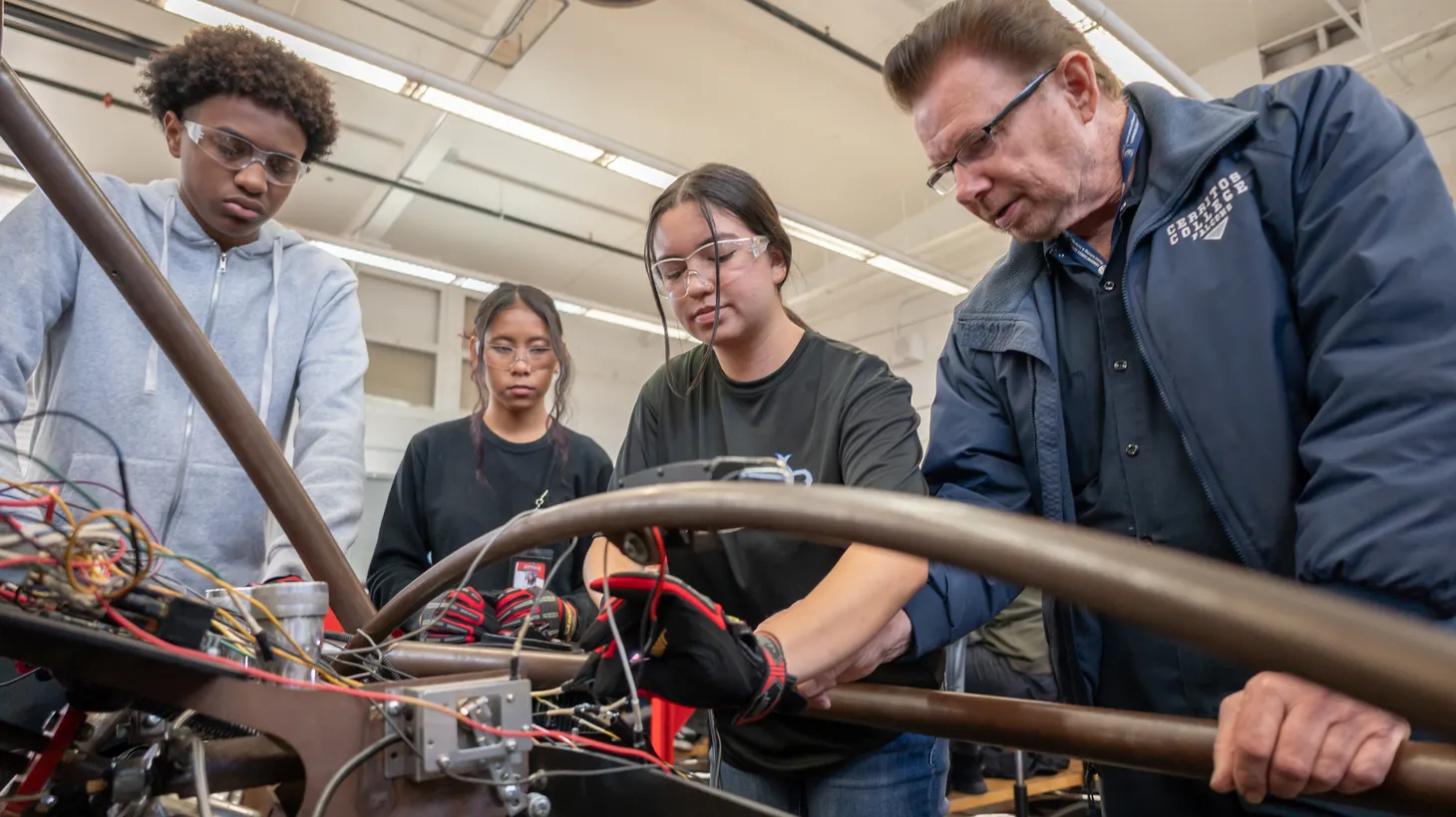 Teenangers learn how to do automotive repairs through LA County’s summer trade skills program.