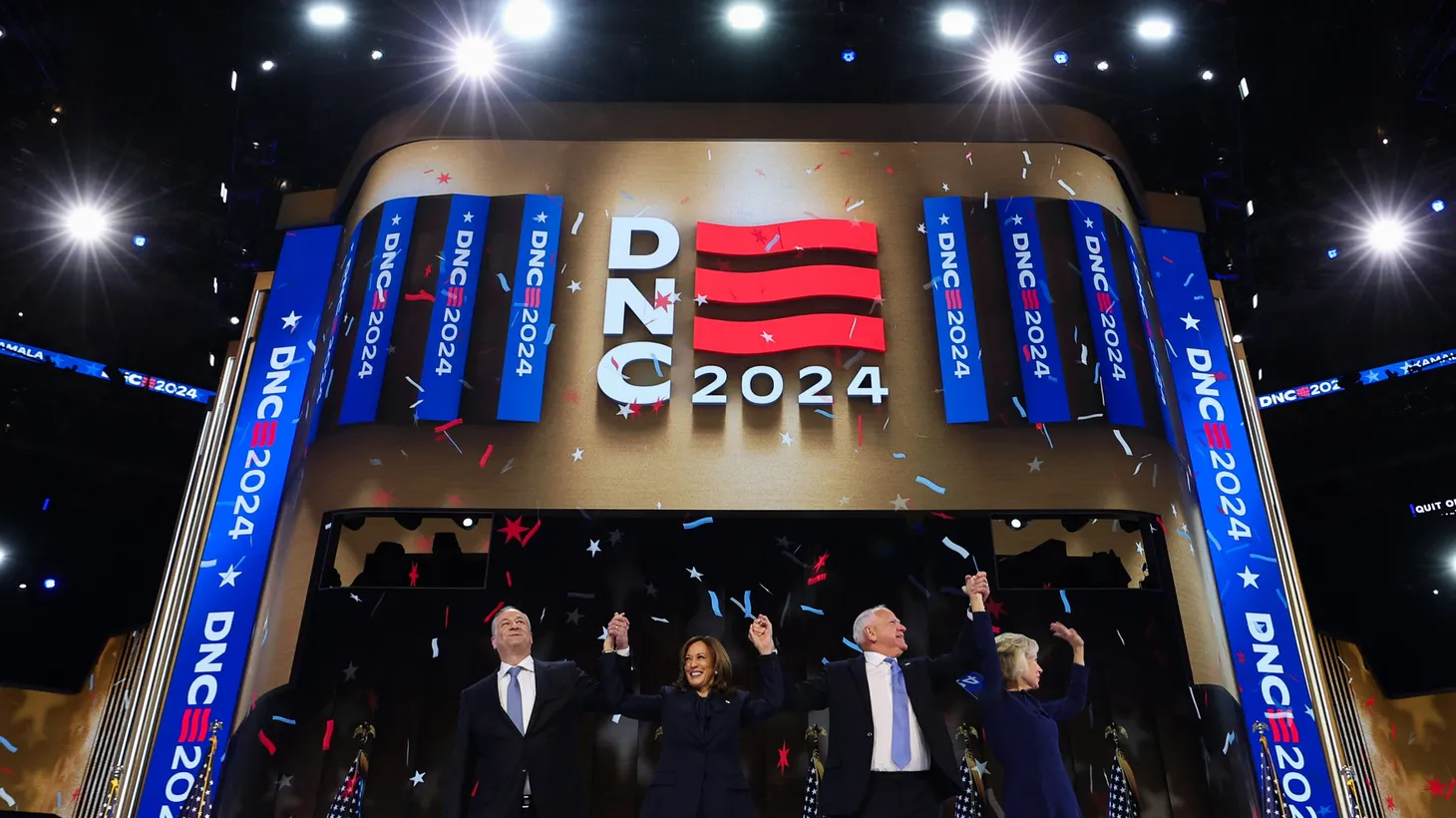 Kamala Harris, her husband Doug Emhoff, Tim Walz, and his wife Gwen stand on stage on Day 4 of the Democratic National Convention (DNC) at the United Center in Chicago, Illinois, U.S., August 22, 2024.