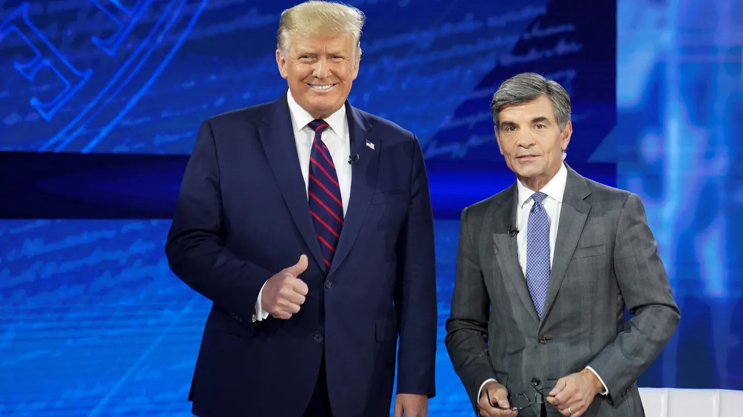 President-elect Donald Trump poses next to ABC News anchor George Stephanopoulos at a town hall event in Philadelphia, Pennsylvania on September 15, 2020.