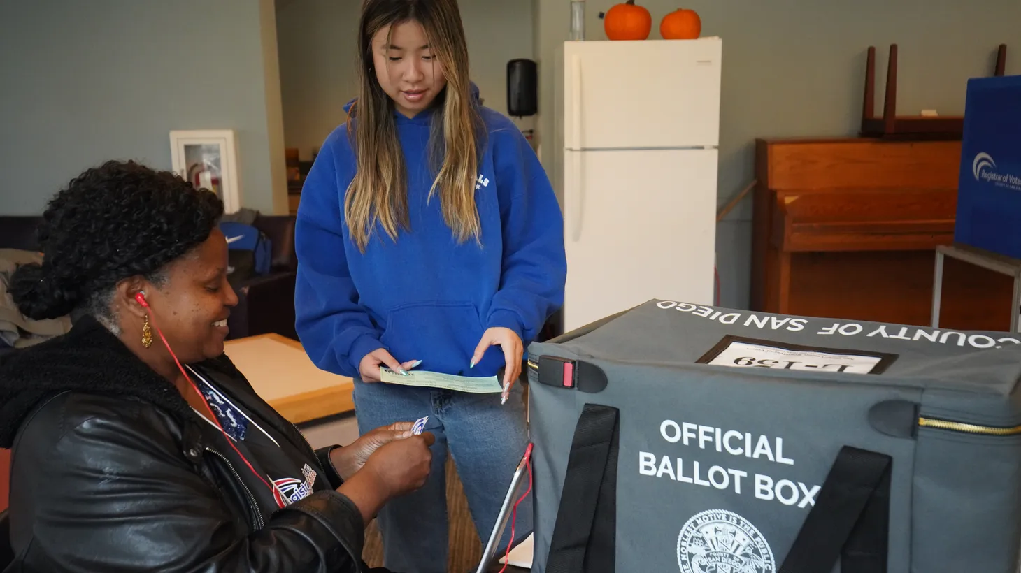 A student submits her ballot at a voting center at the University of California, San Diego, November 2, 2024.