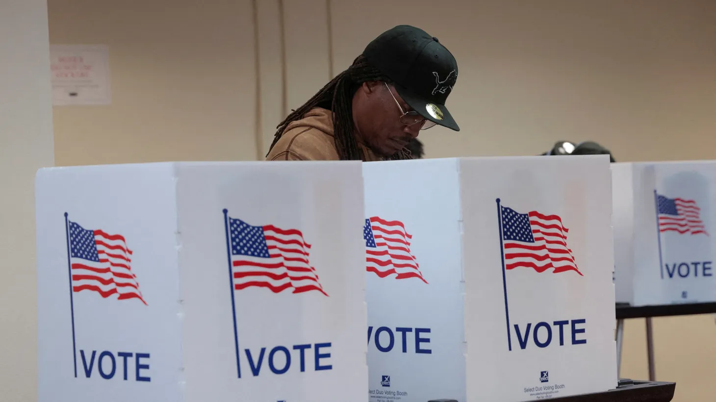 A person participates in early voting in the U.S. presidential election at a polling station in Detroit, Michigan, U.S. November 3, 2024.