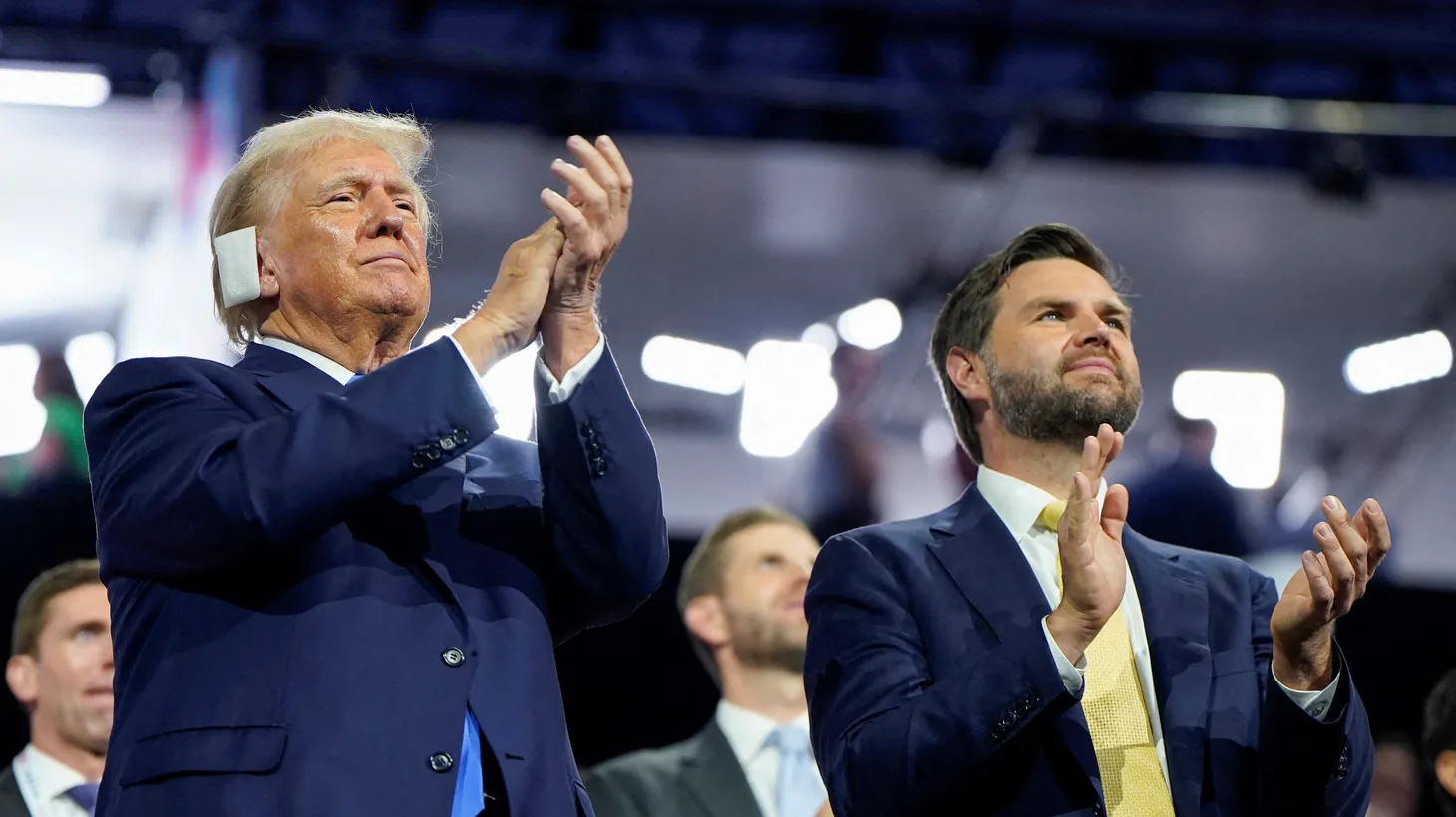 Republican presidential nominee and former U.S. President Donald Trump and Republican vice presidential nominee J.D. Vance applaud on the second day of the Republican National Convention, at the Fiserv Forum in Milwaukee, Wisconsin, U.S., July 16, 2024.