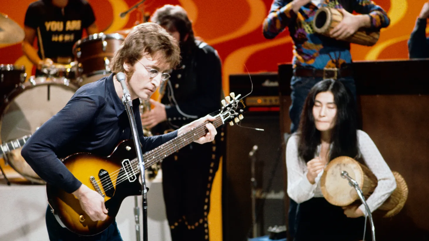 Yoko Ono (right) and John Lennon (left) appear in a scene from “Daytime Revolution.”