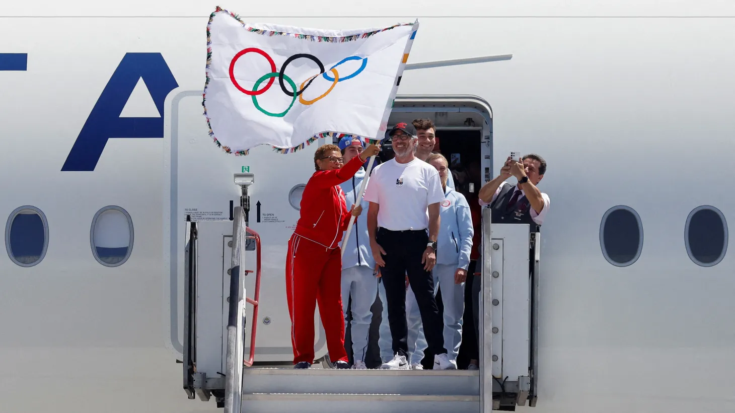 Los Angeles Mayor Karen Bass and LA28 Chairman Casey Wasserman return the official Olympic flag to Los Angeles for the first time in 40 years, ahead of the 2028 Games, in Los Angeles, California, U.S. August 12, 2024.