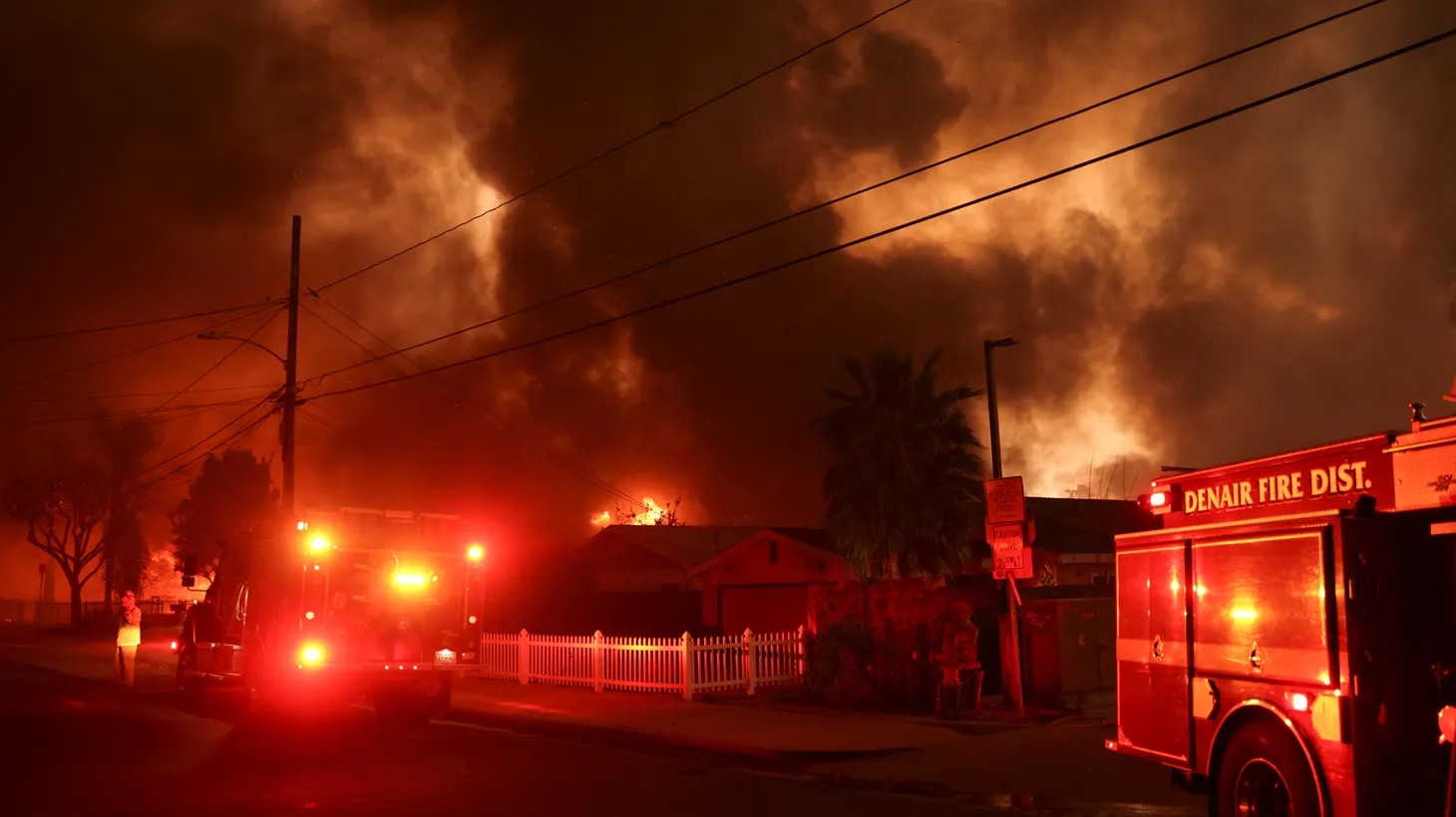 Firefighting vehicles are present as powerful winds fueling devastating wildfires in the Los Angeles area force people to evacuate, at the Eaton Fire in Altadena, California, U.S. January 8, 2025.