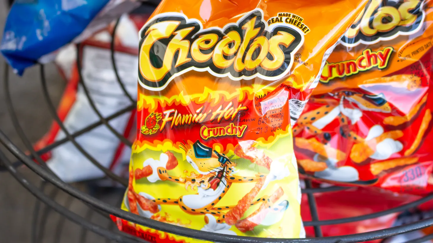 Starting December 2027, Flamin’ Hot Cheetos and other snacks with synthetic dyes will need new recipes if they want to remain on school campuses.