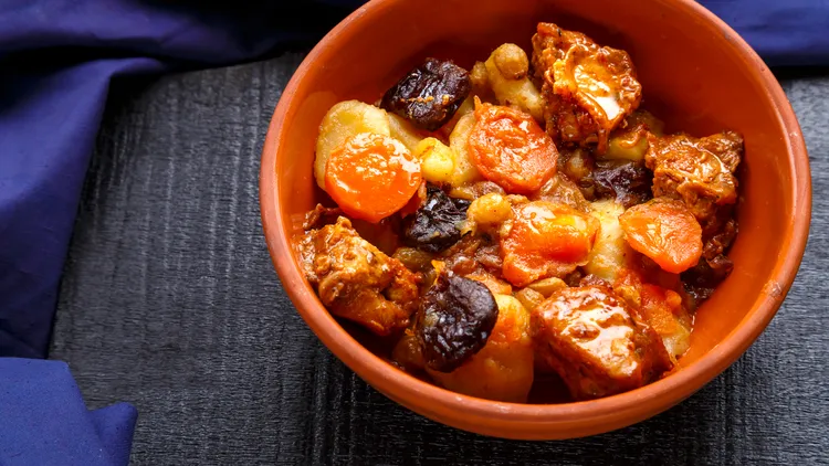 Tzimmes is the Yiddish word for making a big fuss. It’s also a stew of sweet root vegetables and dried fruit, often served for Rosh Hashanah.