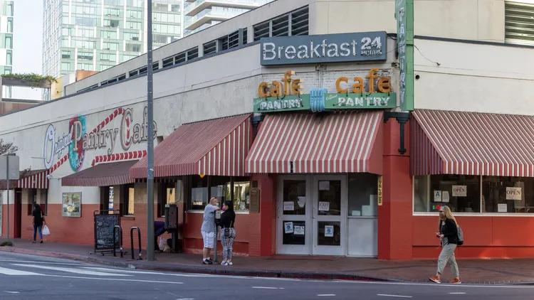 The Original Pantry Cafe, famous for its pancakes, abruptly shut down amid a labor dispute, leaving loyal patrons and decades-long employees heartbroken.