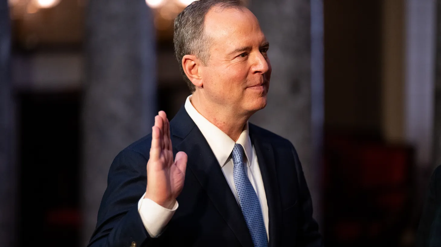 Sen. Adam Schiff, D-Calif., raises his right hand for his ceremonial swearing-in administered by Vice President Kamala Harris in the Old Senate Chamber on Monday, December 9, 2024.