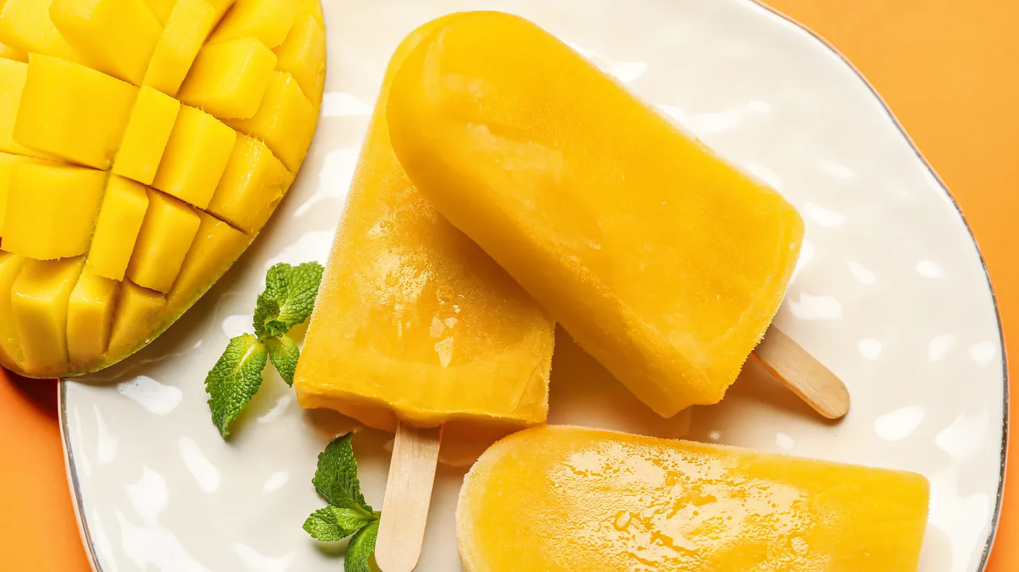 A mango popsicle is a great choice for cooling down in the summer.